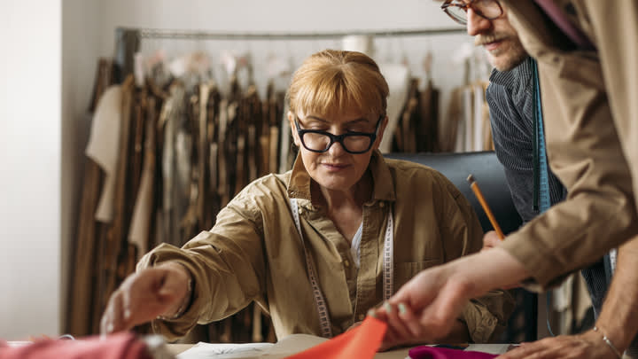 Person looking at fabric for clothing