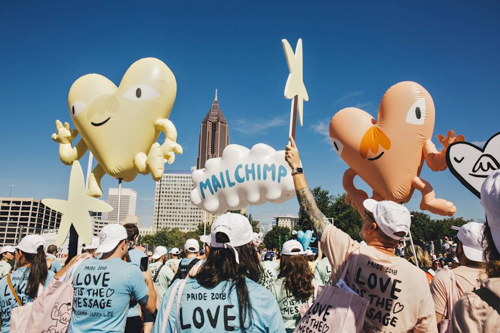 Mailchimp employees participate in a Pride parade 